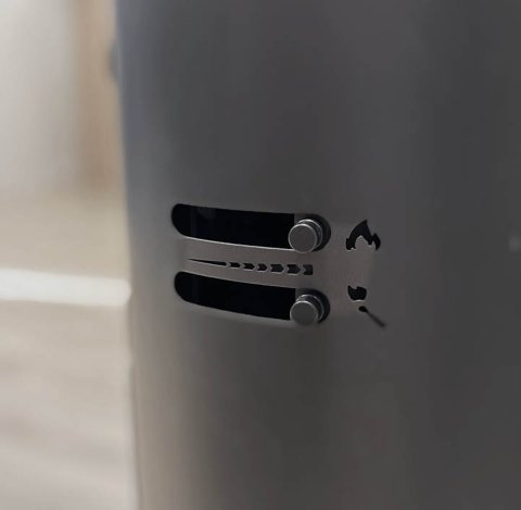 Siden av sort vedovn Scan 68 med intuitive luftkontroller